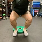 Someone squatting with raised heels